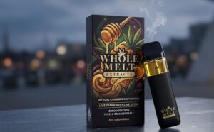 Authentic Whole Melt Extracts dual chamber 2g disposable pen resting beside its signature graphic box.